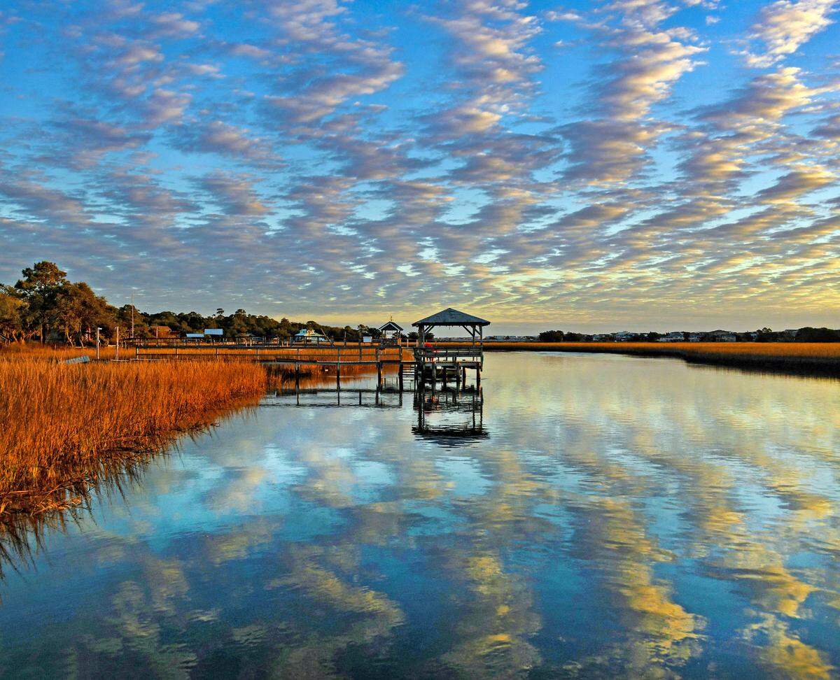 Sunrise at a creek dock in Pawleys Creek in Pawleys Island.