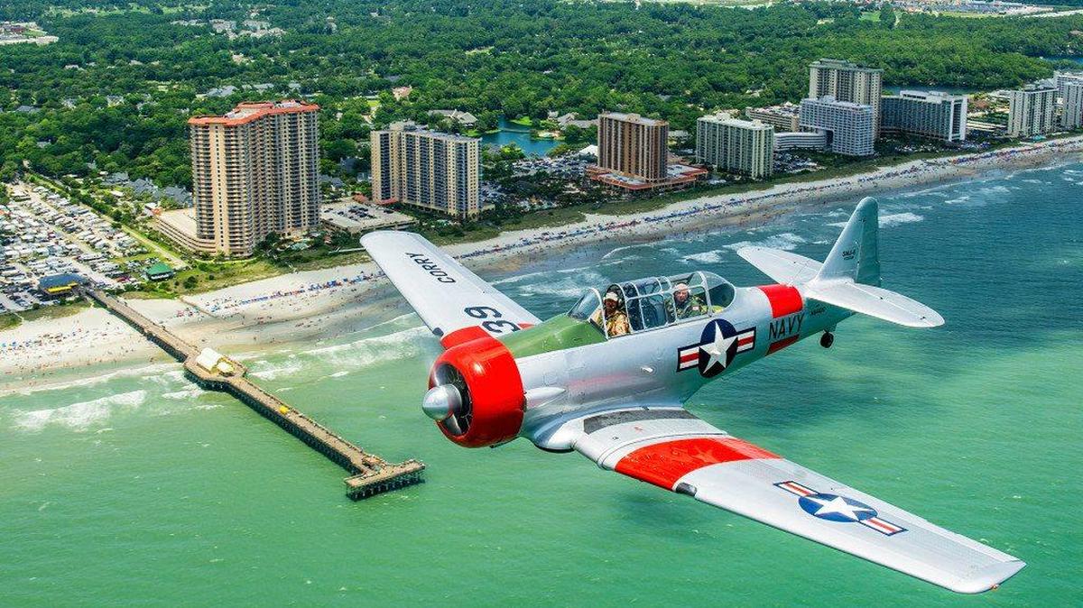 A vintage military plane is seen being flown in the 2015 “Salute From the Shore” by the Apache Family Campground Pier area, just north of Myrtle Beach. On Tuesday, the eighth annual flyover, with F-16 jets from the 20th Fighter Wing at Shaw Air Force Base in Sumter, as well as older aircraft, will go along the Atlantic Ocean coast from the Cherry Grove Fishing Pier area of North Myrtle Beach at 1 p.m. July 1, heading southwest to Hilton Head Island within an hour. Everyone’s asked to line beaches, wave flags, and wear – and decorate in – red, white and blue. Details at 803-331-8881 or salutefromtheshore.org.