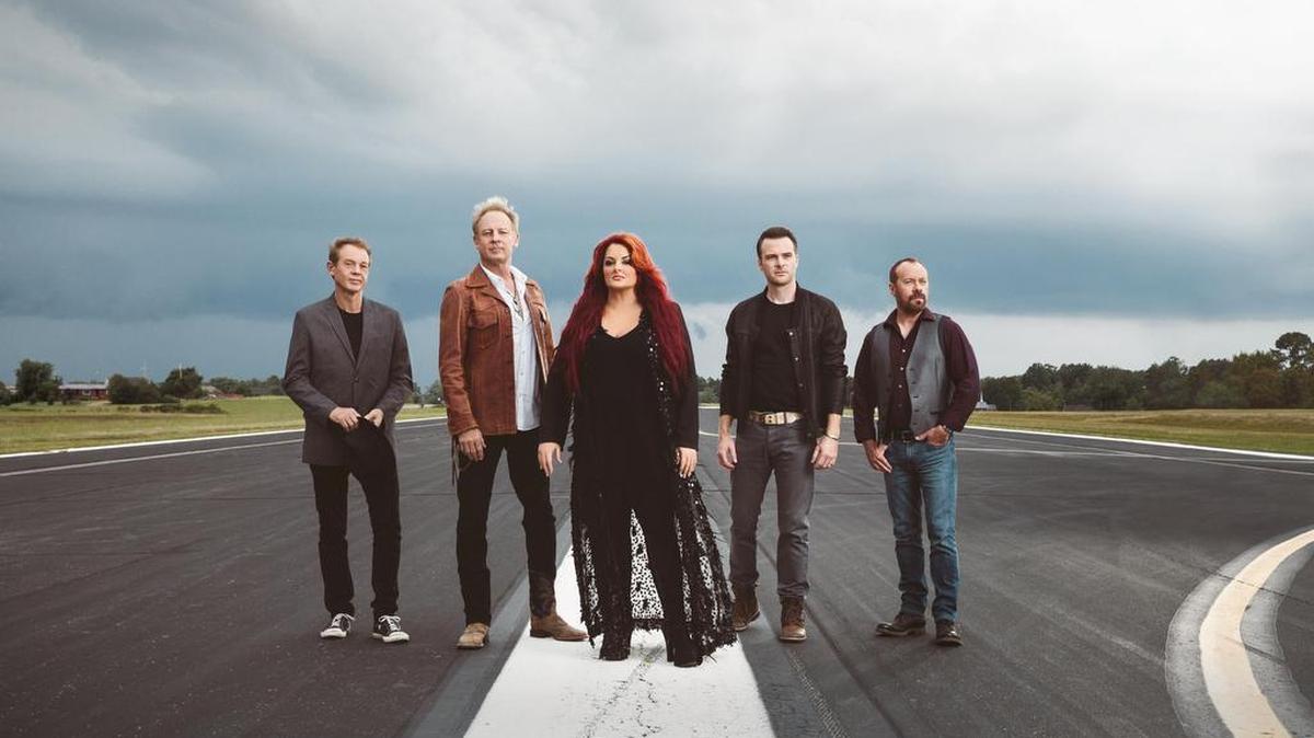 Wynonna & the Big Noise will play at 6 p.m. Sunday at the Calvin Gilmore Theater, 8901 N. Kings Highway (U.S. 17 Business), Myrtle Beach. This photo shows the quintet, including Wynonna Judd in center, with her husband, Cactus Moser – the bandleader, producer and drummer – to her immediate right. Concert details at 843-913-4000, 800-843-6779 or www.thecarolinaopry.com, and www.wynonna.com.