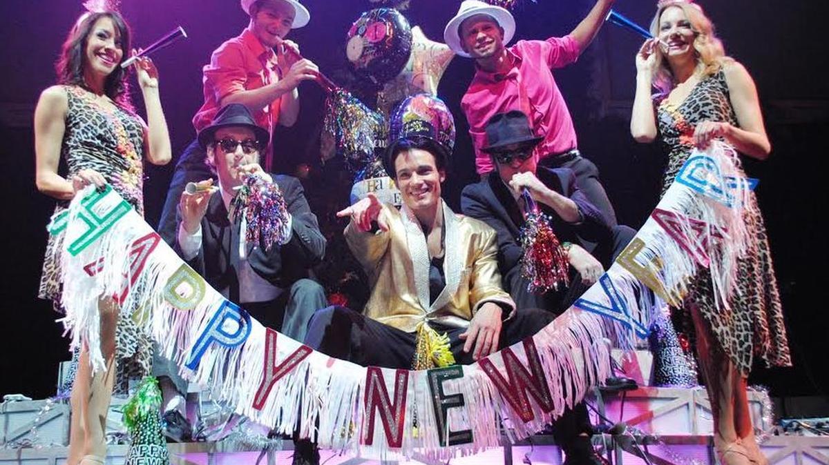 Natalie Cesario-Beck (standing, far left), dance captain for Legends in Concert in Myrtle Beach, said helping count down the seconds until New Year’s is a celebration not only with an excited audience, but with the show cast, another “family” in her life.