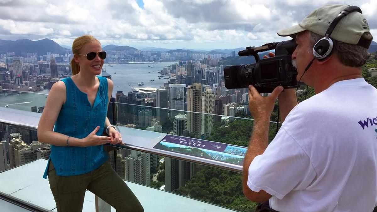 This photo shows Darley Newman, Myrtle Beach childhood native, filming behind the scenes of Victoria Peak, for “Travels with Darley,” for which she is host and producer. The episode this Friday covers “Hong Kong: Island Hopping,” concluding the second season for this series, 7:30-8 p.m. on ETV across South Carolina (scetv.org) – including WHMC-TV 23 of Conway and WITV-TV 7 of Charleston. Details at www.travelswithdarley.com.