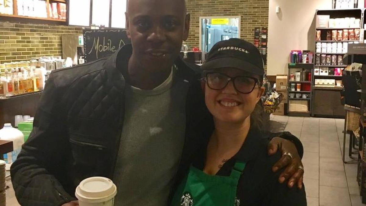 Comedian Dave Chappelle poses with Starbucks employee Halie Perry in Beaufort on Sunday.