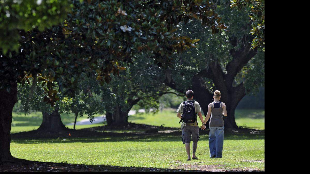 
A couple go for a stroll at Brookgreen Gardens. 
