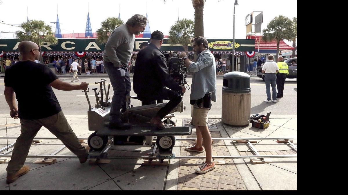 
Ocean Boulevard is the scene for filming of "Magic Mike XXL" on Tuesday, Nov. 4, 2014. Hundreds of extras and onlookers watched scene after scene that included the actors walking into the Boardwalk Resort, a scene at the pool behind the resort and a Rolls Royce driving slowly on the boulevard past the arcade. 
