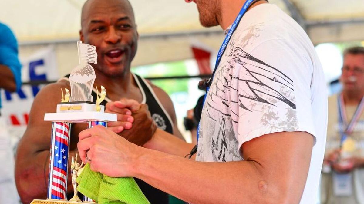 Steven Schuster, right, shakes hands with retired Major Leaguer Reggie Sanders on July 4, 2015, after winning Croissants Bistro & Bakery’s fifth annual “Fourth of July Cupcake Eating Contest.” The eatery’s 2016 competition will be 2-4 p.m. Monday, at Broadway at the Beach Heroes Harbor area, on 29th Avenue North in Myrtle Beach, again benefiting the Reggie Sanders Foundation, helping families with children with autism. Adults are invited to enter for $25 at croissants.net/2016-cupcake-contest.