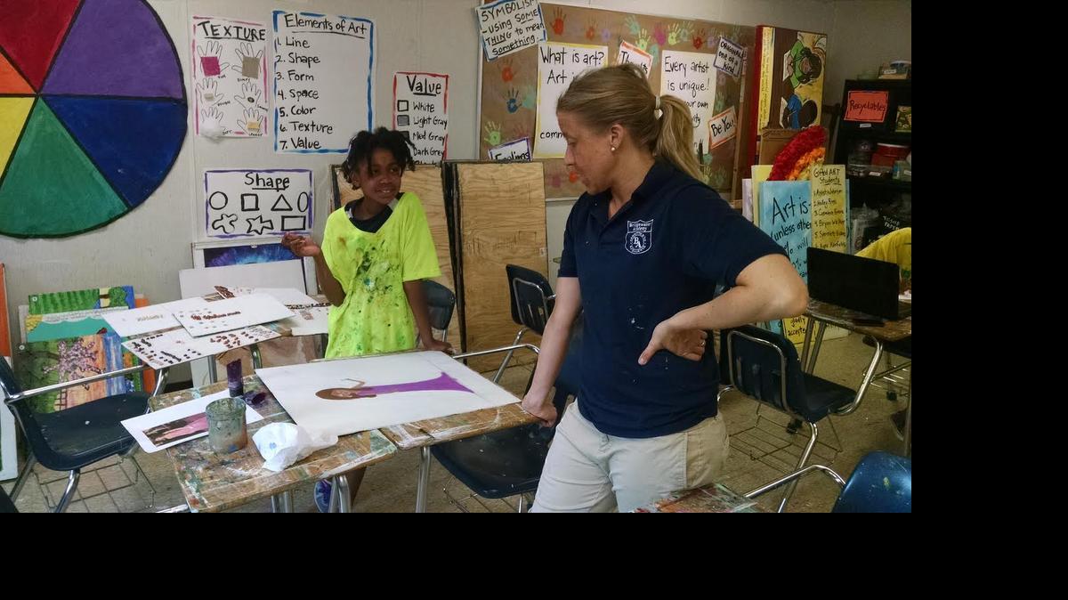 
Ayesha Johnson (left) confers about her painting with art teacher Caitlin Beidler at Bridgewater Academy Charter School, which will have its “Elements of Art Show,” 5-7 p.m. Saturday at the school, just west of Myrtle Beach.
