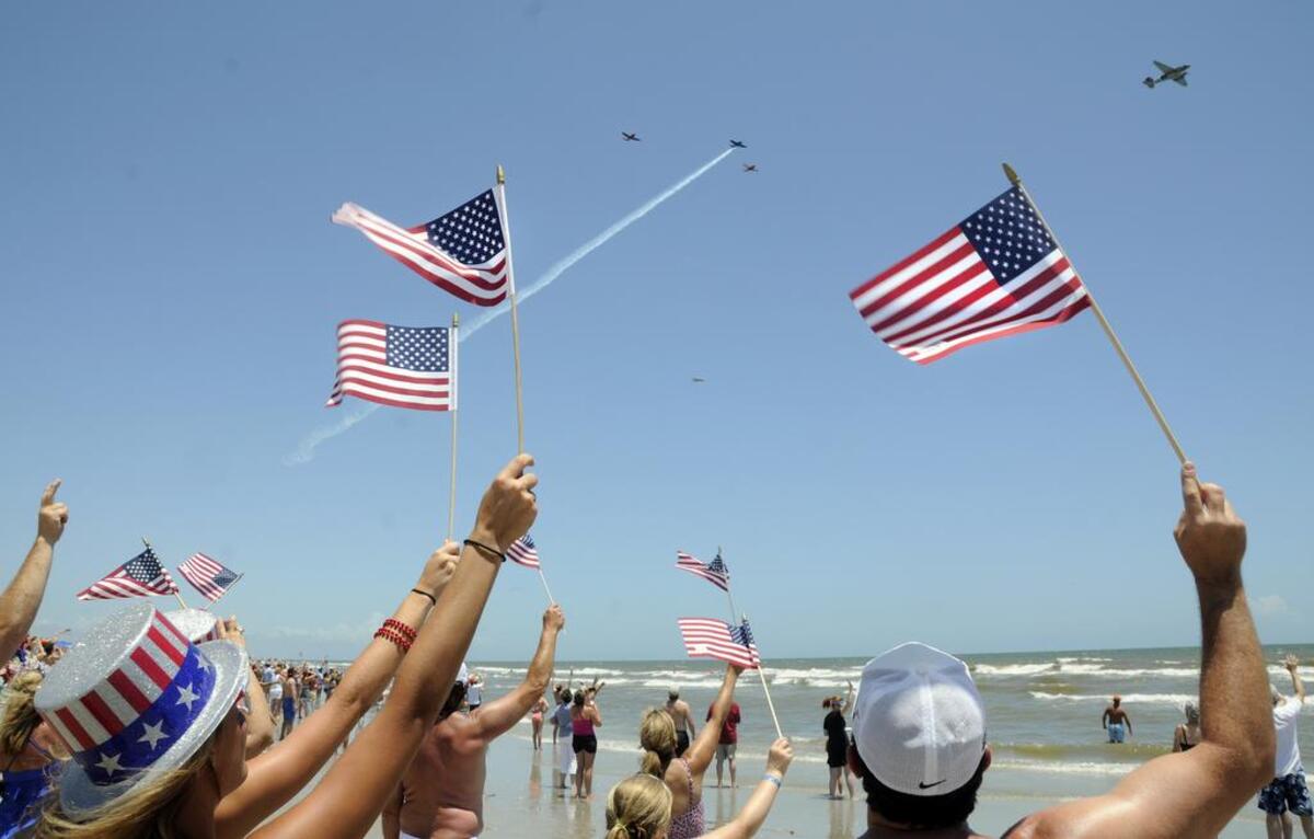 Individuals in Litchfield Beach wave flags on July 4, 2013, during the “Salute From the Shore,” which for 2016, is Monday, starting at 1 p.m. from Cherry Grove Fishing Pier, heading southwest along the Atlantic coast to Bluffton within the hour. Everyone’s asked to line beaches, wave flags, wear red, white and blue attire, and decorate in patriotic colors. Details at salutefromtheshore.org, or email salute@salutefromtheshore.org.