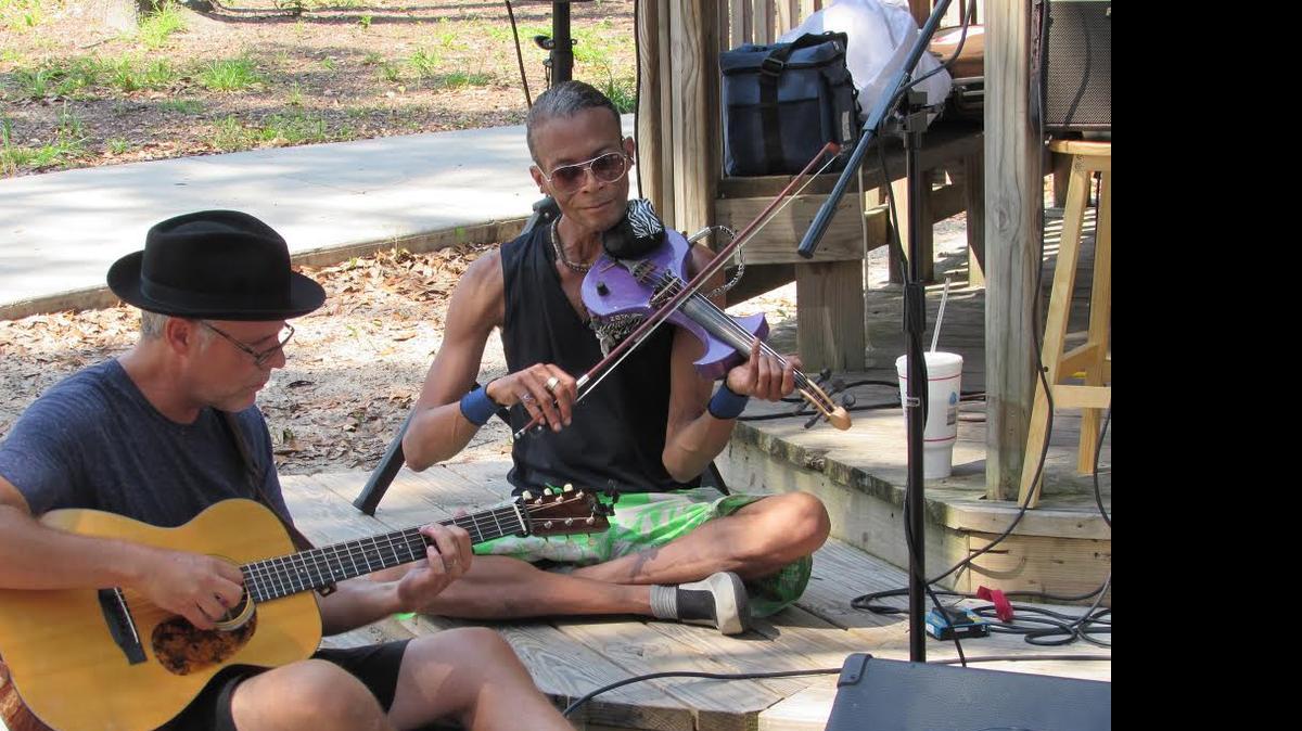 
Randall Hill plays guitar, and Phillip Swaby the violin, during a “Surfside Sunday Serenades” concert last summer in Surfside Beach. The seventh annual weekly series continues through September.

