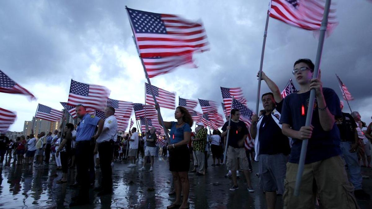 A large crowd bearing U.S. flags looks on as a memorial wreath is carried out to sea in remembrance of the victims of terrorist attacks from Sept. 11, 2001 during the city of North Myrtle Beach’s annual “9-11 Candlelight Vigil” in 2010 in North Myrtle Beach. The service The 2016 service will be at 7 p.m. Sunday at the city’s Horseshoe, at Main Street and Ocean Boulevard.