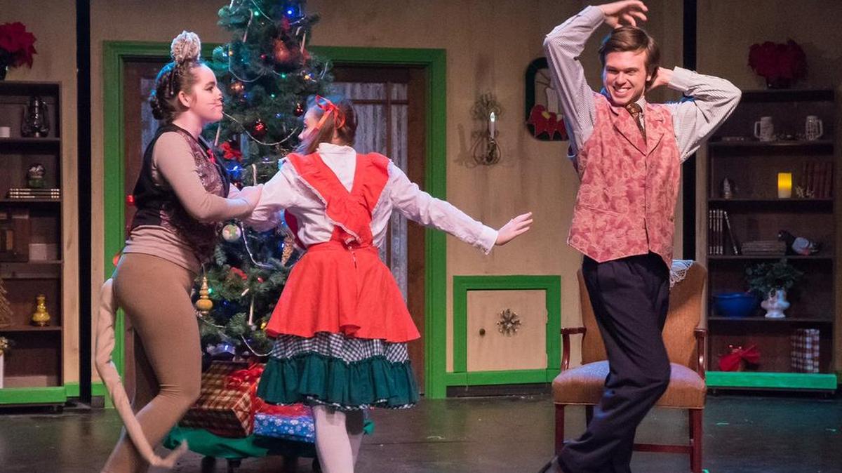 Shaughnessy Burns, Josephine Kirkman, Austin Bell, Amos Mouse, Emily, and Uncle Brierly dance around the Christmas tree.