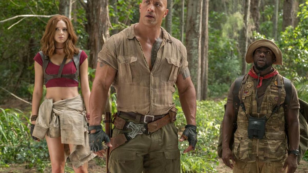 This image released by Sony Pictures shows Karen Gillan, from left, Dwayne Johnson and Kevin Hart in “Jumanji: Welcome to the Jungle.”