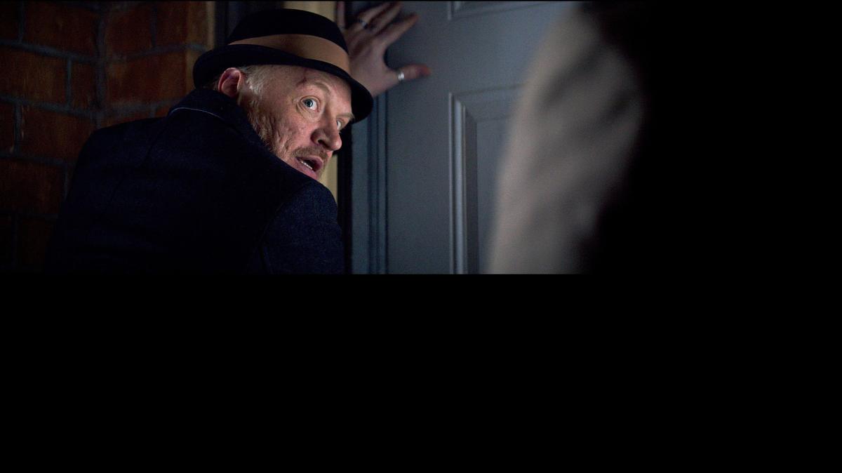 
Gifted medium Carrigan Burke (Jared Harris) leads the fight to retrieve a child from the world of the poltergeists in the film “Poltergeist.”
