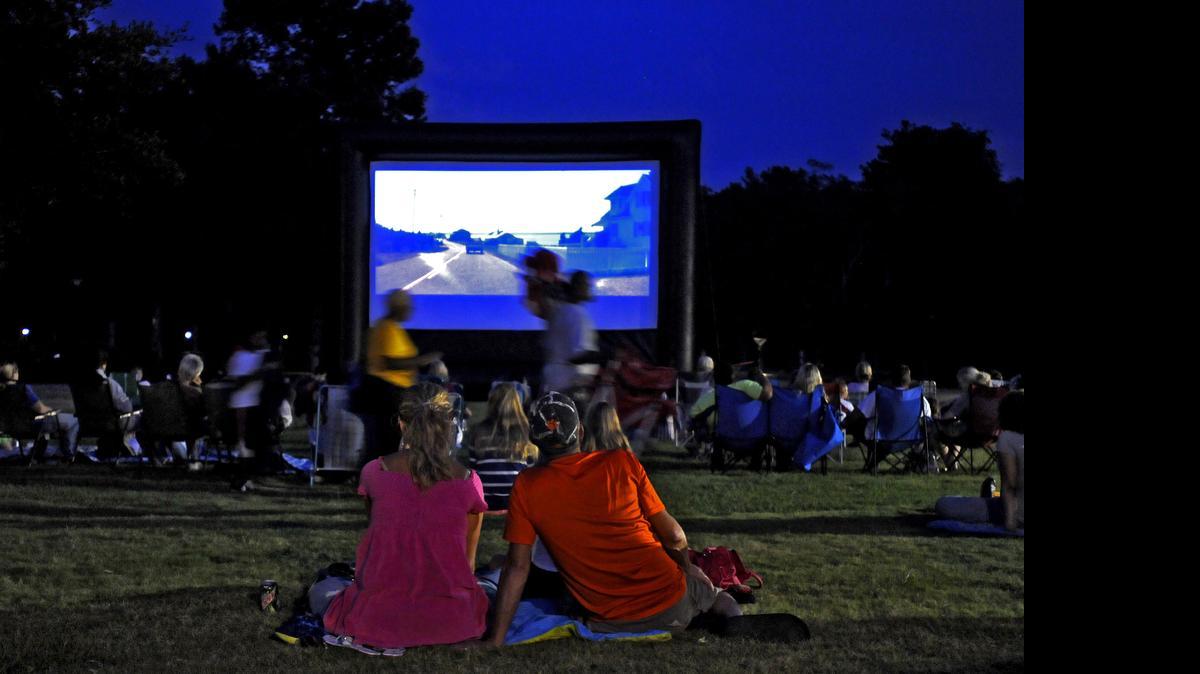 
A crowd enjoys “Jaws” during the “Movies in the Park” night in July 2012 at Conway’s “Riverfront Park.” In the 2015 series, “Jurassic Park” is next, at about 8:30 p.m. Friday.
