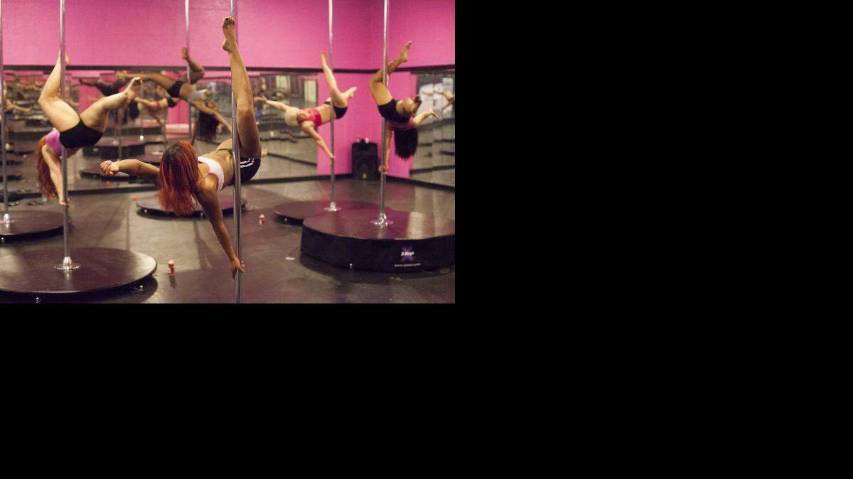 
The advance students in the pole fitness class perform a high-flying routine at Teazers Pole Fitness & Dance Studio in Myrtle Beach.
