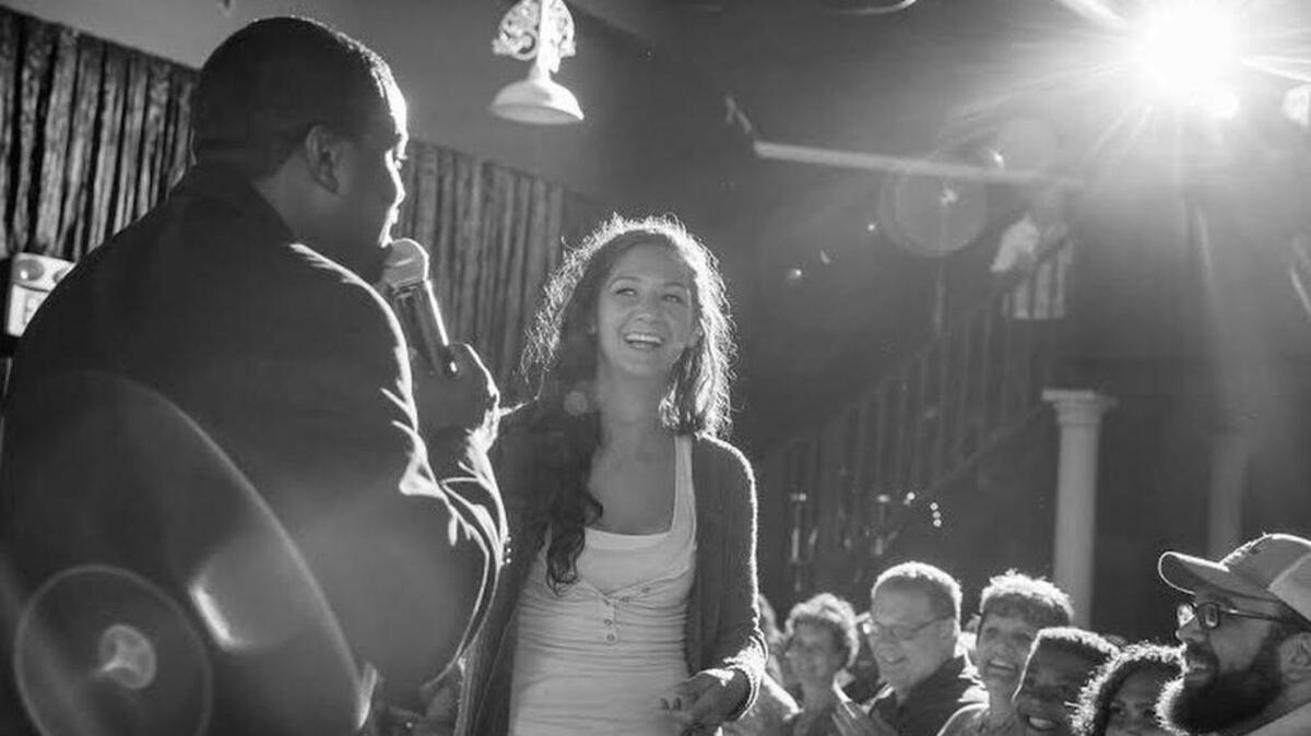 Mario Pearson of Motor City Musical performs with audience member at GTS Theatre.