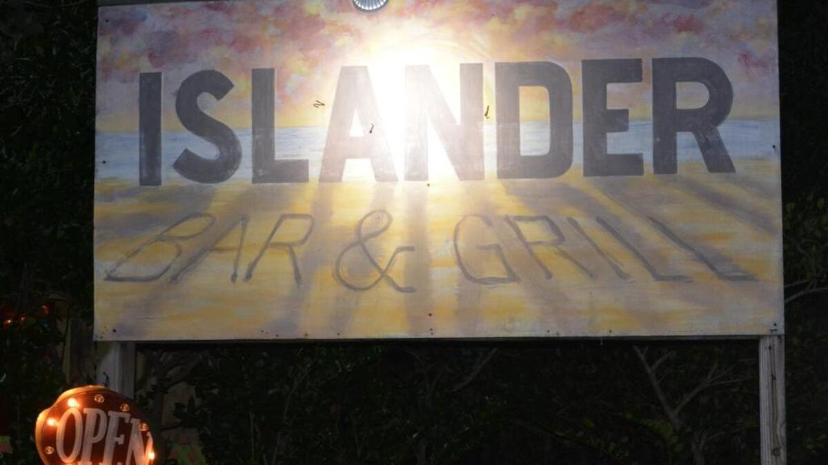
A sign at The Islander Bar & Grill in Pawleys Island. Photo by Derrick Bracey for The Surge.
