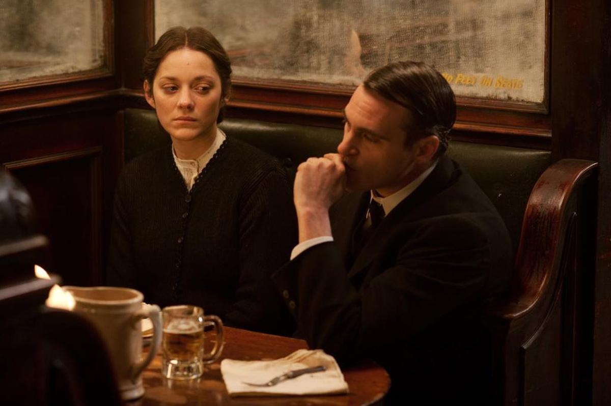 This photo released by the Weinstein Company shows Marion Cotillard, left, and Joaquin Phoenix, in a scene from the film, The Immigrant.”