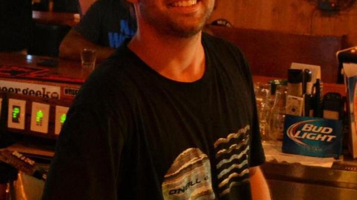 
Dustin Walters, 27, tends bar at Island Bar and Grill in Pawleys Island. Photo by Derrick Bracey, for The Surge.
