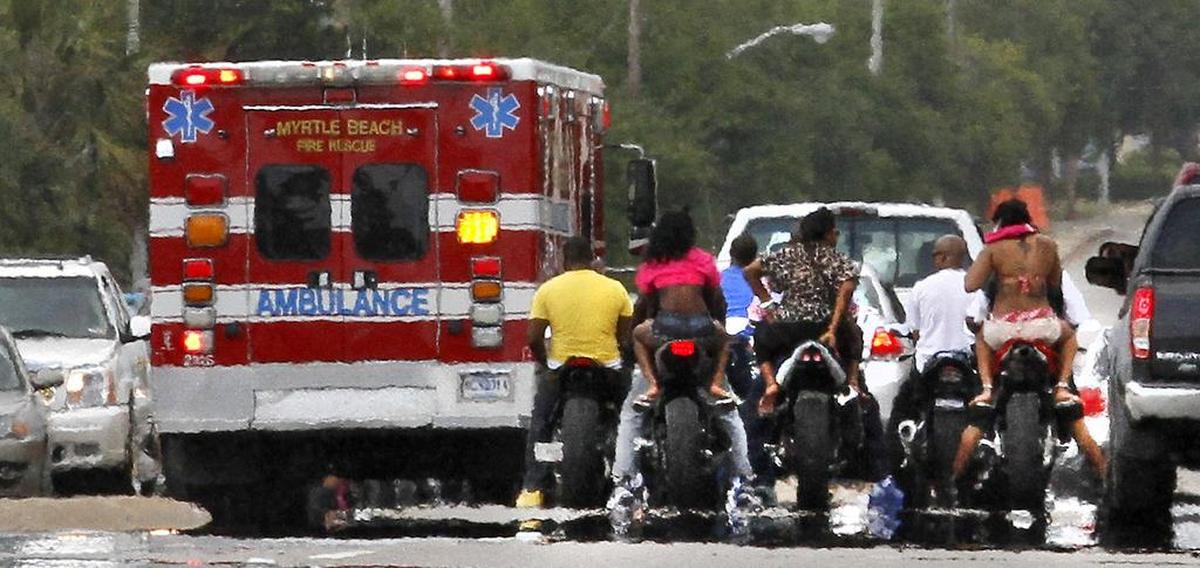 An ambulance leaves the scene with a victim of a reported three-motorcycle injury traffic accident at 19th Avenue North closed down Kings Highway in Myrtle Beach.