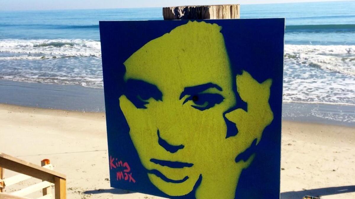 
A King Max woodblock painting makes an appearance on the beach. Photo by Derrick Bracey, for The Surge.
