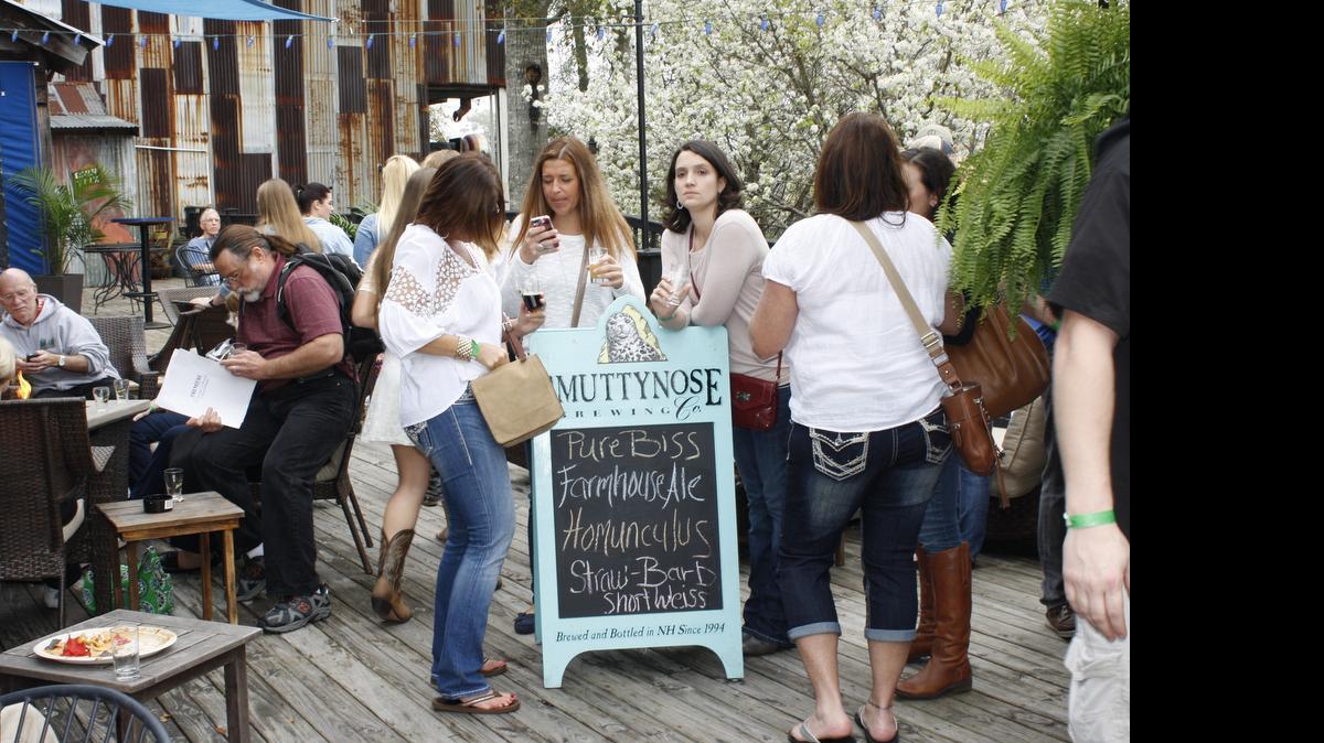 
A group of women hang out around the Smuttynose Brewing Company sign at the 2014 BeerFest at House of Blues in North Myrtle Beach.
