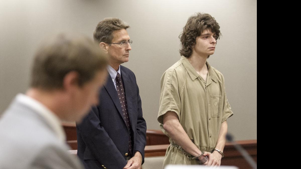 
Solicitor Josh Holford reads the charges of seven counts of arson as Ryan Patrick Casiere stands with his attorney Buddy Long in district court.
