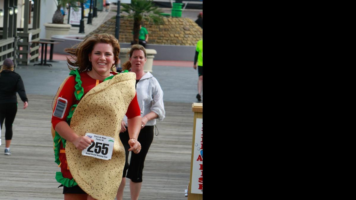 
Laura Smith of Carolina Shores, N.C., sports a taco costume during the Cinco de Mayo Fiesta Run, sponsored by Carlos & Charlie’s at Broadway at the Beach. The Sun News file photo.

