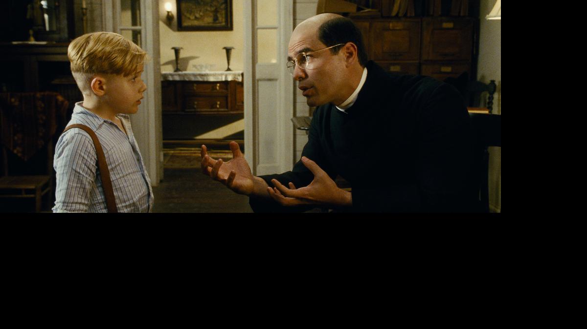 
Jakob Salvati as Pepper Flynt Busbee and Eduardo Verastegui as Father Crispin in “Little Boy.”
