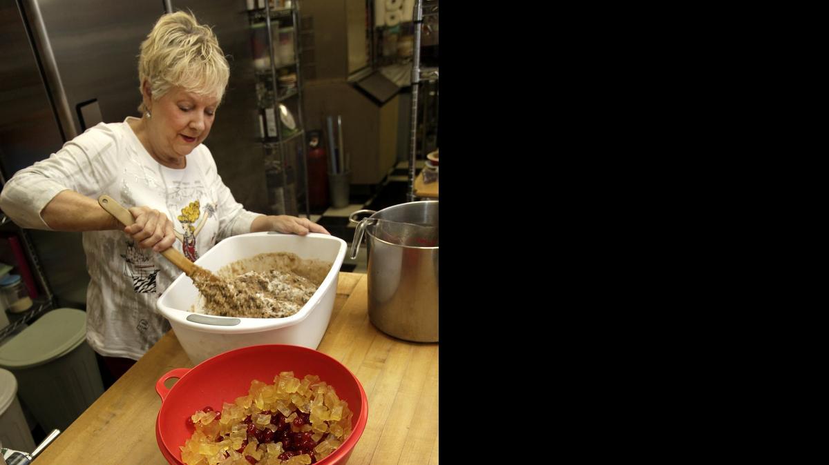 
Barbara Crady, a master baker, mixes up her recipe for fruitcake at her restaurant Crady's on Main St. in Conway. File photo.
