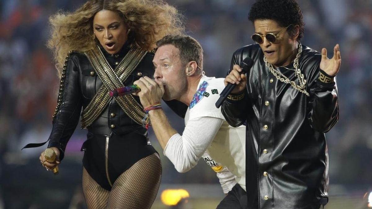 Beyoncé, Coldplay singer Chris Martin and Bruno Mars perform during halftime of the NFL Super Bowl 50 football game Sunday, Feb. 7, 2016, in Santa Clara, Calif.