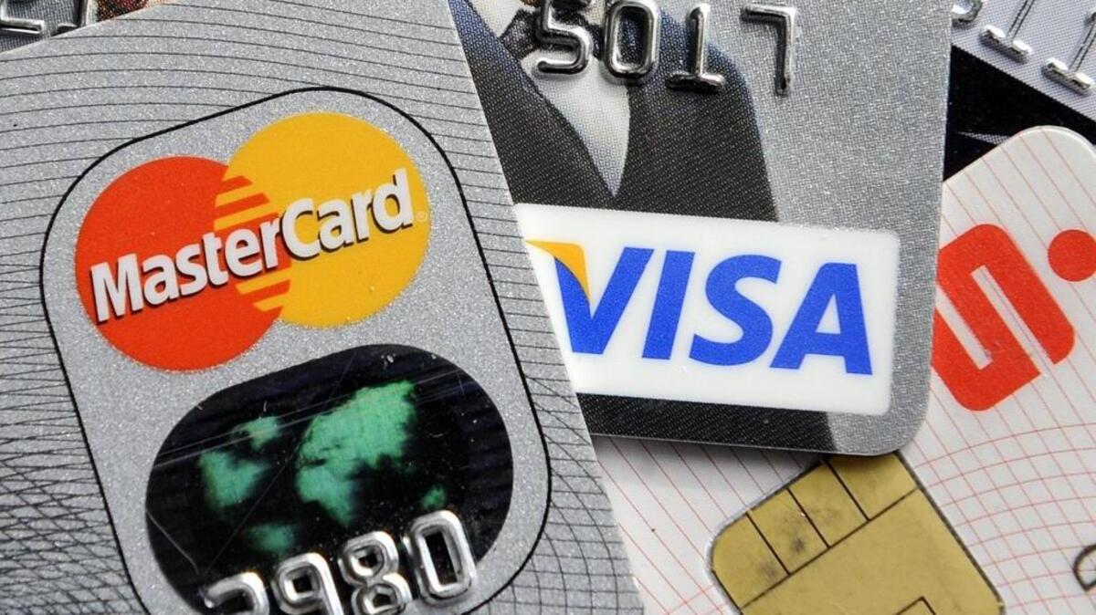 
Credit and bank cards with electronic chips. The new chip adds a unique, one-time code that changes every time you use your card to make an in-store payment. That automatic security code change makes your data nearly impossible to use to create a counterfeit card. The Associated Press file photo.
