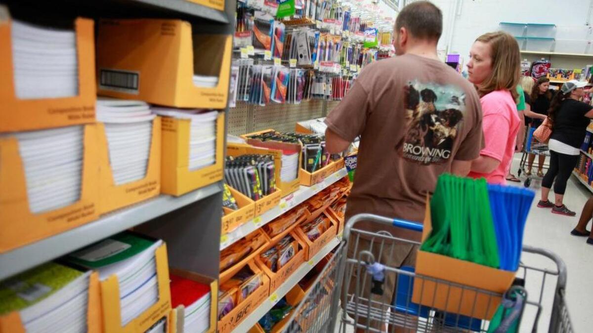 
Waites Greene of Tabor City, N.C., talks with his wife Amanda as they shop for back to school supplies. The Sun News file photo.
