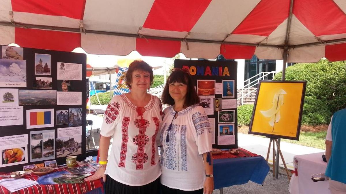 Marina Quarticelli, left, and Gabriela Brown enjoyed the Romanian booth at the 2016 Brunswick Intercultural Festival