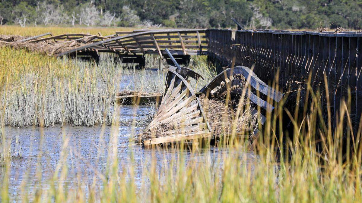 The walkway over the marsh at the Huntington Beach State Park Nature Center was twisted and broken by Hurricane Ian’s storm surge and flooding. Volunteers and state park workers from around South Carolina have worked to repair Huntington Beach State Park for days since Hurricane Ian brought damaging flooding to the popular attraction. Oct. 5, 2022.