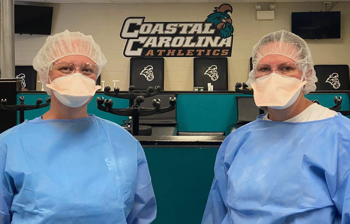 Health workers from Tidelands Health tested Coastal Carolina football players for the coronavirus on Monday.