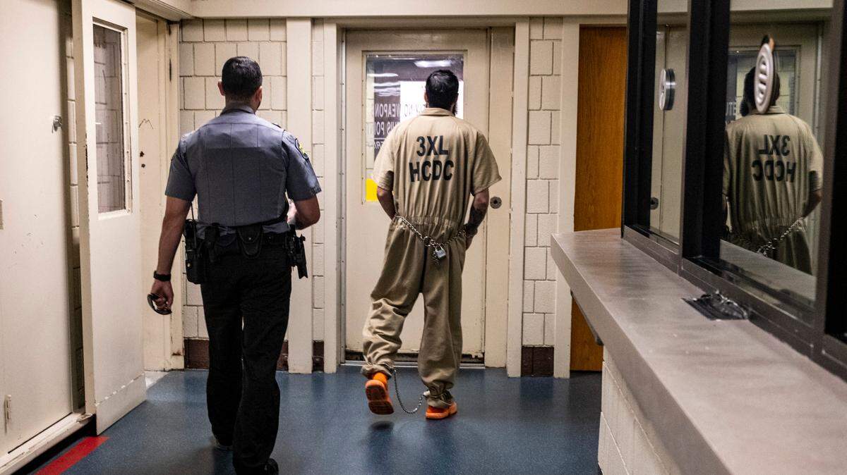 An inmate is led through the hallway of the J. Reuben Long Detention Center near Conway, S.C. October 12, 2023.