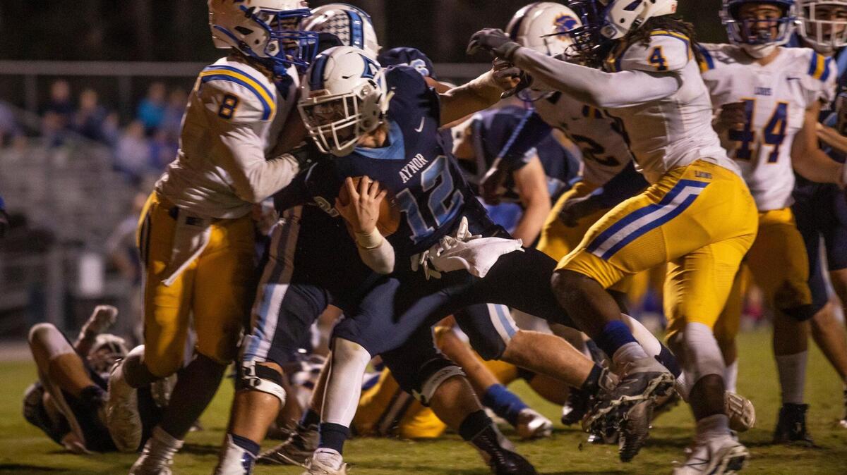 Aynor’s Grant Prosser pushes into the end zone against Loris. The Blue Jackets hosted the Lions in their 2020 homecoming football game. October 23, 2020.