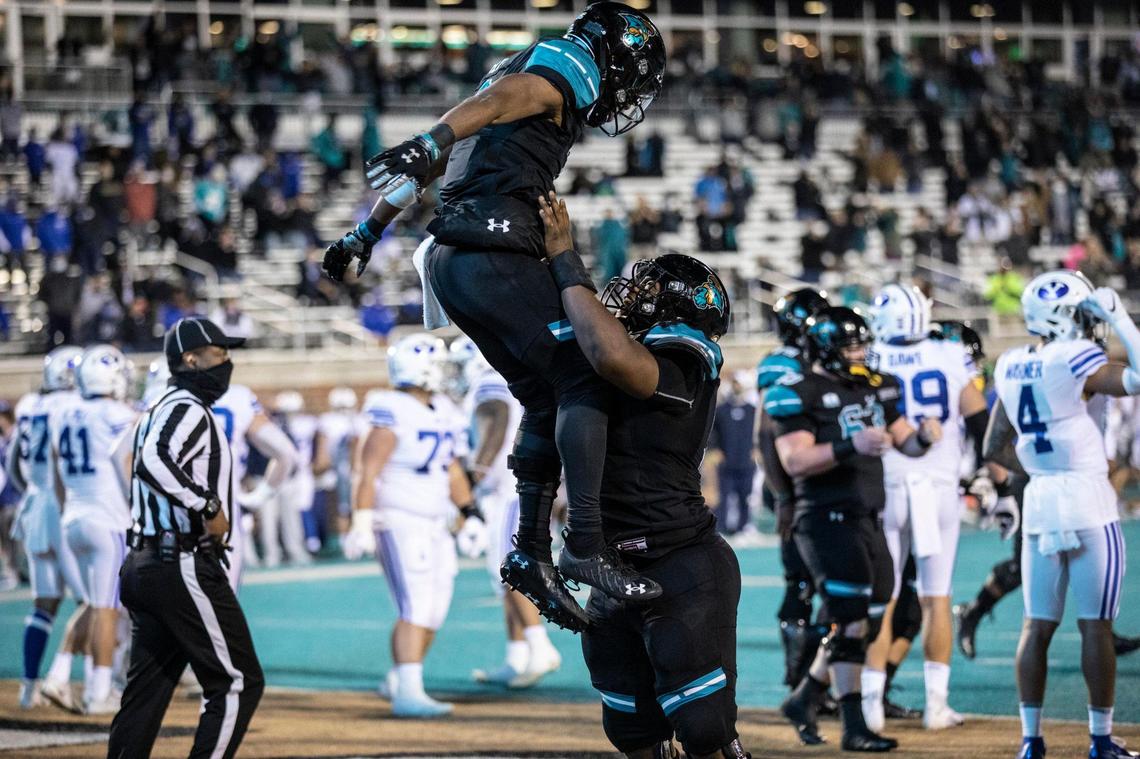 Coastal’s Reese White celebrates a touchdown run against BYU on Saturday night. Coastal Carolina University, ranked #14, takes on #8 ranked Brigham Young University at Brooks Stadium in Conway, S.C. December 5, 2020.