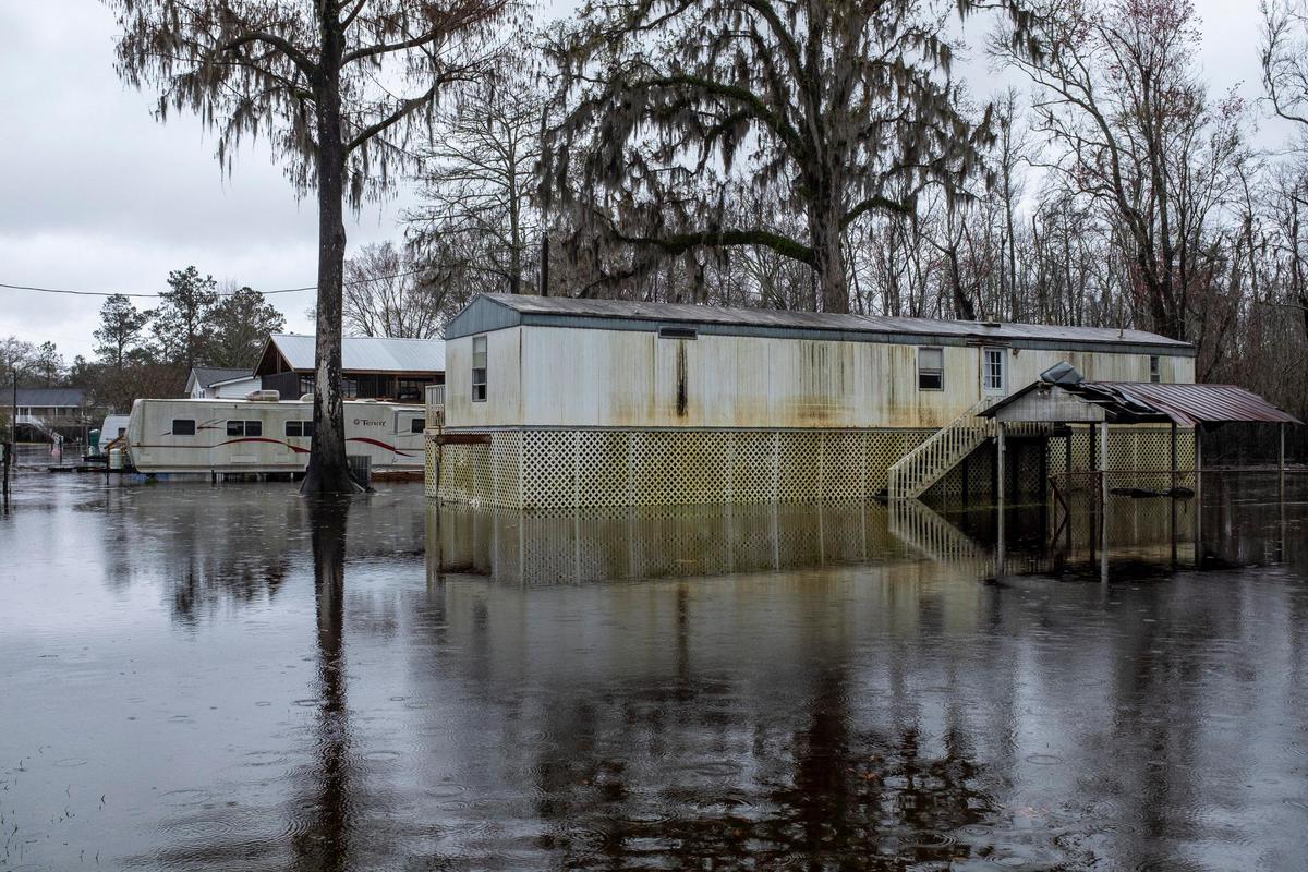 A Pitch Landing home damaged in the 2018 flood following Hurricane Florence sits surrounded by flood waters again on Wednesday, Feb. 19, 2020.