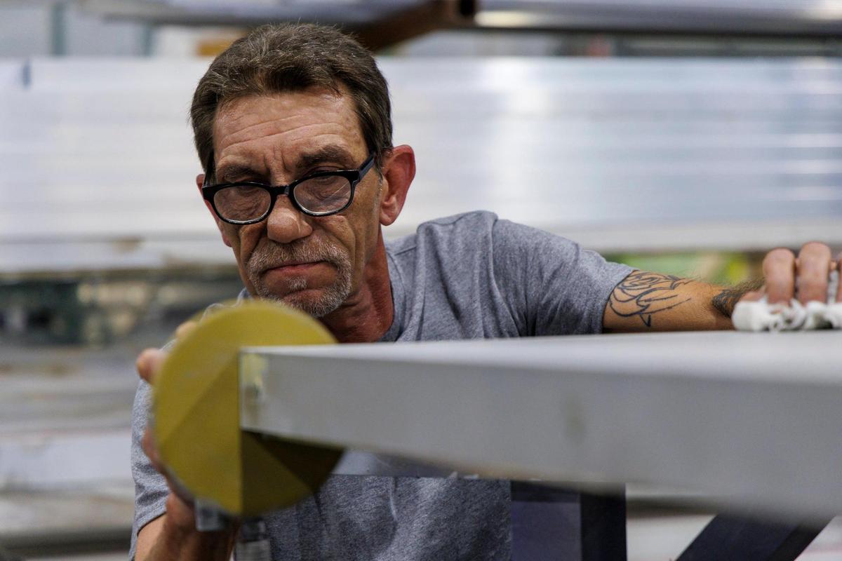 Joseph Rasinski works on a sign at ASL Signs in Myrtle Beach. The Murrells Inlet resident has spent more than a decade working on beach signs for homes, hand painting and customizing them through techniques he has learned over the years. He will now use his skills at ASL. July 15, 2025.