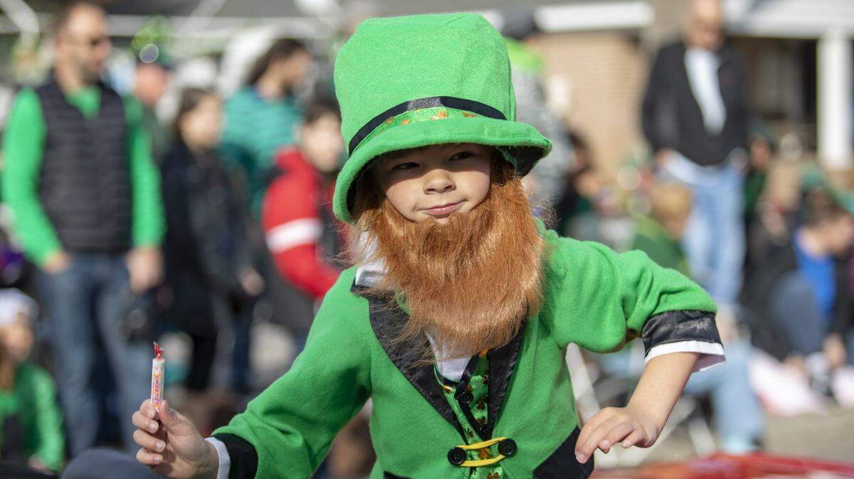 A little boy dressed as a leprechaun throws out candy along Main Street in North Myrtle Beach during the St. Patrick’s Day parade Saturday.