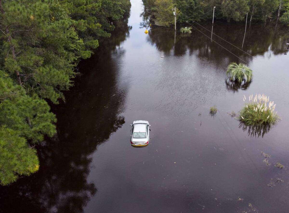 A car sits flooded in the middle of S.C.905 in The Red Bluff community. Red Bluff flooded along the Waccamaw River and Simpsons Creek under Hurricane Florence’s deluge with entire neighborhoods underwater. Monday, Sept. 24, 2018.