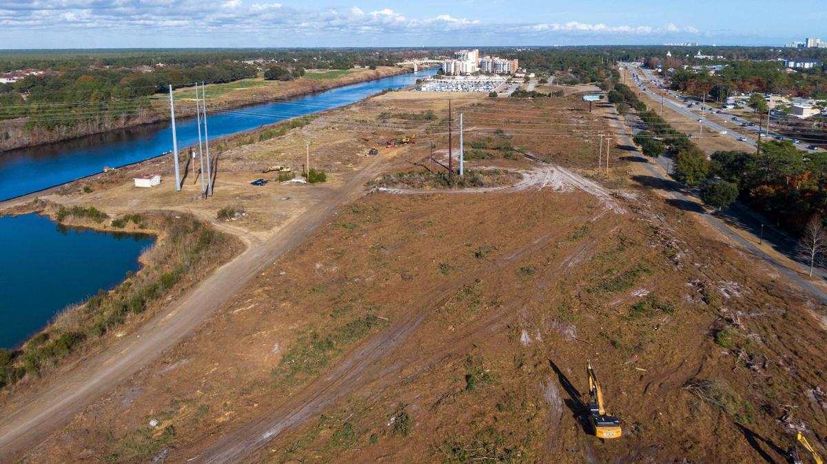 Land next to the Intracoastal Waterway has been cleared for the Marina Village by a Boston development group. The property is almost 76 acres and sits across the highway from the Grand Strand Hospital. Dec. 16, 2024.