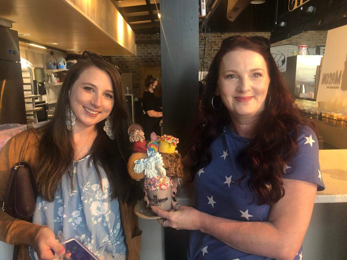 Ronda Jackson (left) and Barbara Jackson of Dunn, N.C., hold The Billboard milkshake Monday at The Crazy Mason Milkshake Bar at 810 Billiards & Bowling in The Market Common.