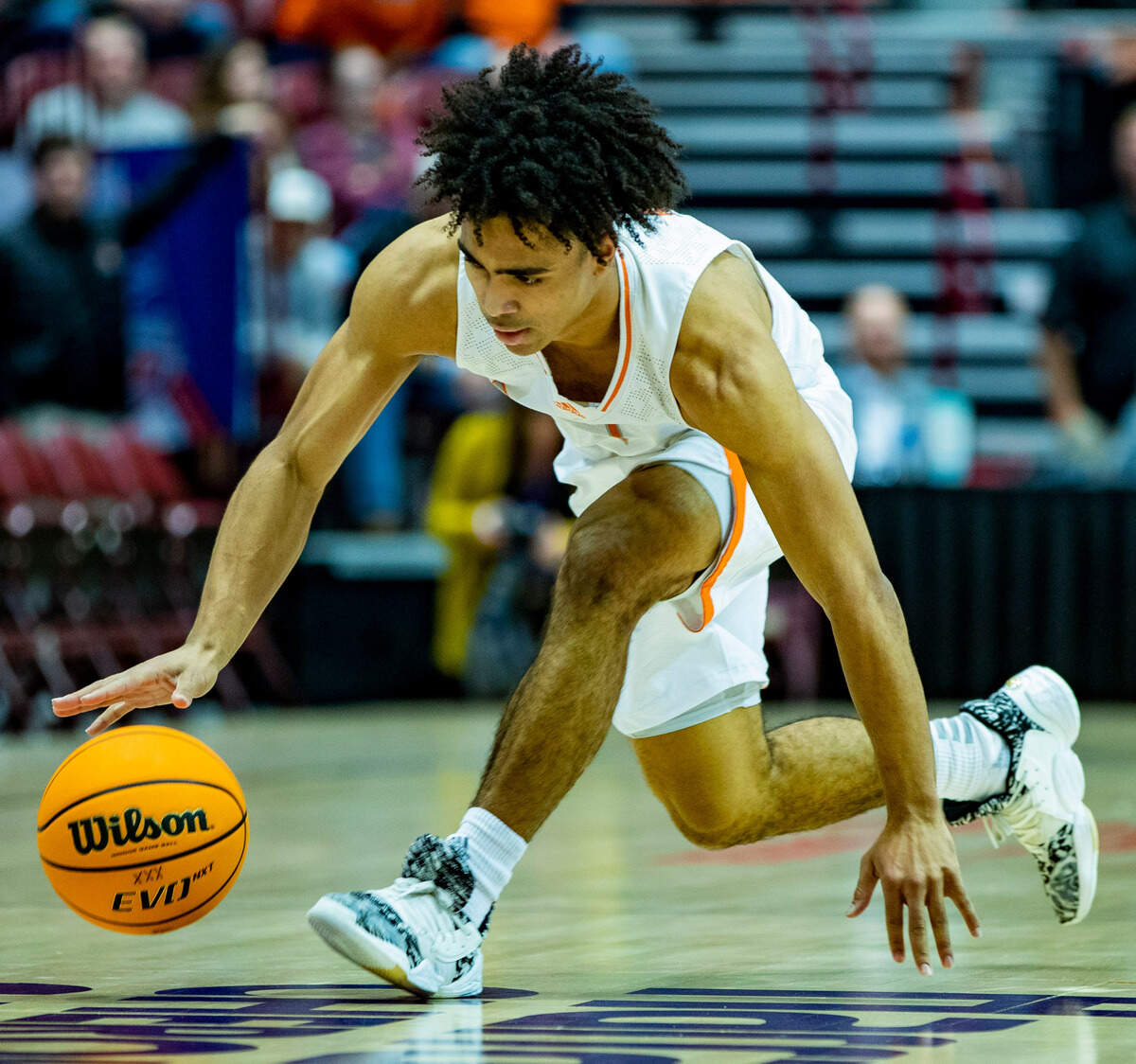 Mercer junior guard Kamar Robertson trips as he brings the ball down the court against West Carolina junior forward Marlow Gilmore Friday night during the SoCOn Ingle Basketball Championships at the Harrah’s Cherokee Center in Asheville, N.C.