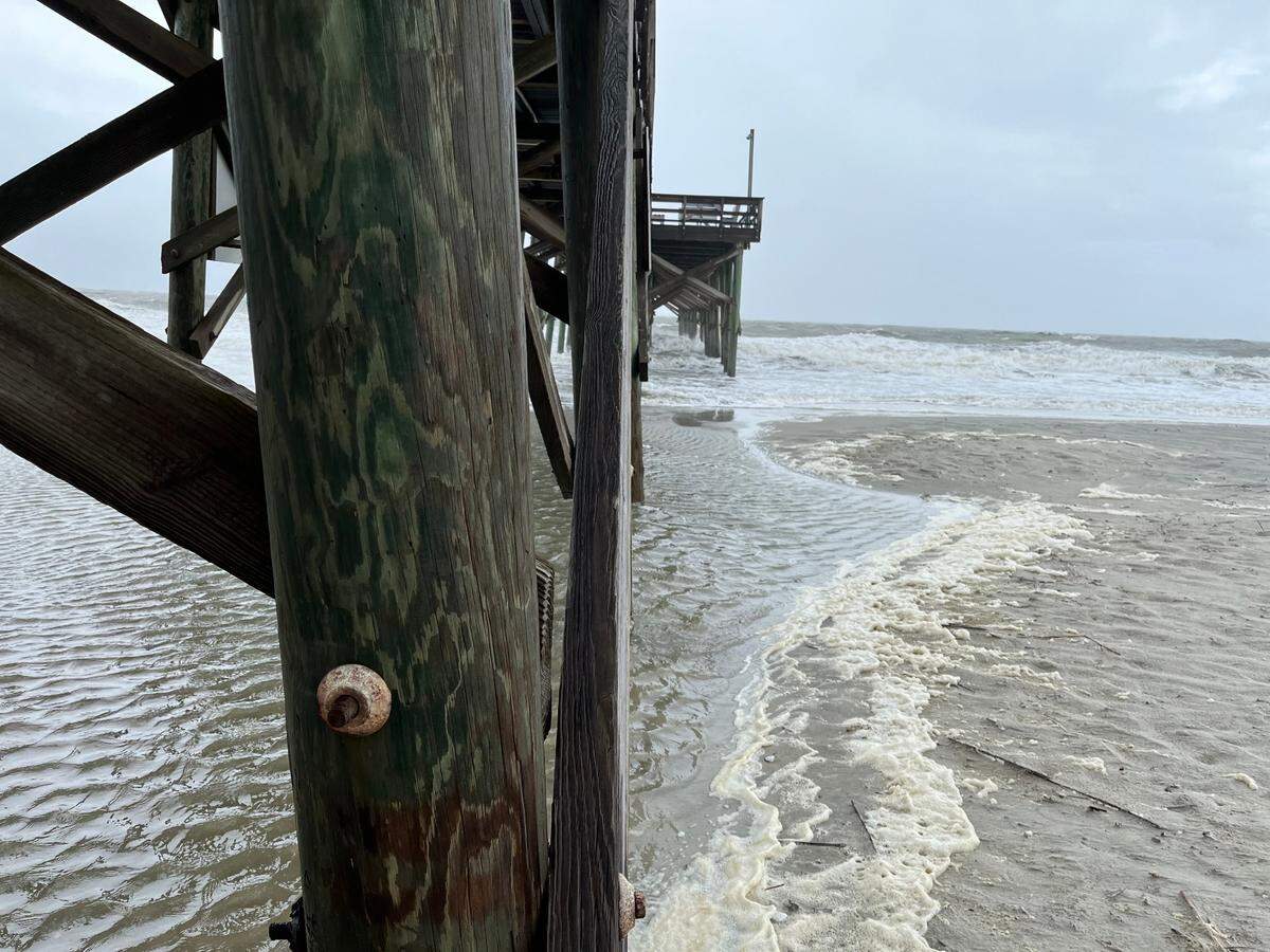 High tide Wednesday morning beneath the pier on Pawleys Island as Tropical Storm Debby begins impacting the area. The pier was destroyed two years earlier from storm surge during Hurricane Ian.