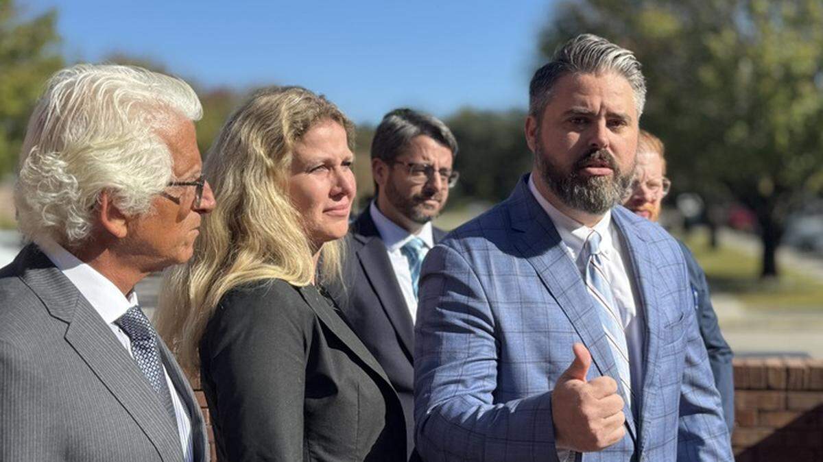 Alexandra Bialousow, who was accused of starting the Carolina Forest wildfire, appeared with her legal team, including attorney Jonny McCoy, outside of court in Myrtle Beach on Wednesday, Oct. 22, 2025.