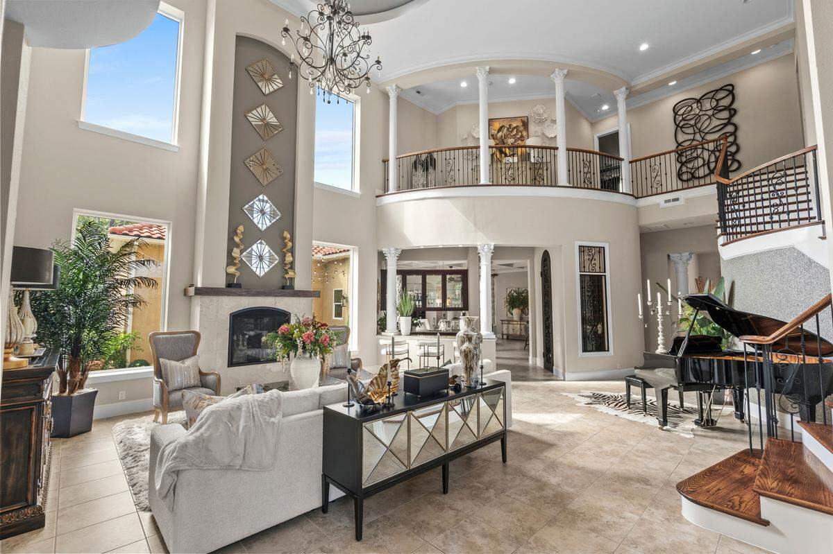 The formal living room features soaring ceilings.