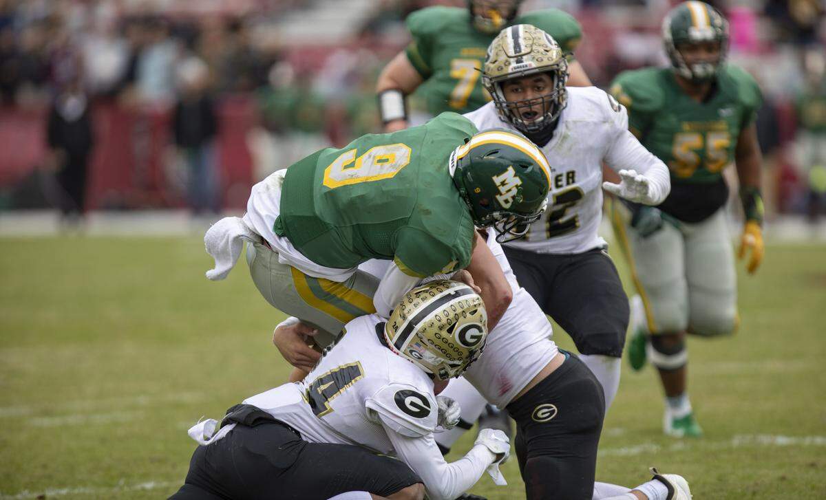 Myrtle Beach junior quarterback Luke Doty runs the ball Friday at Williams-Brice Stadium as the Myrtle Beach Seahawks take on the Greer Yellow Jackets in the AAAA State Championship game.