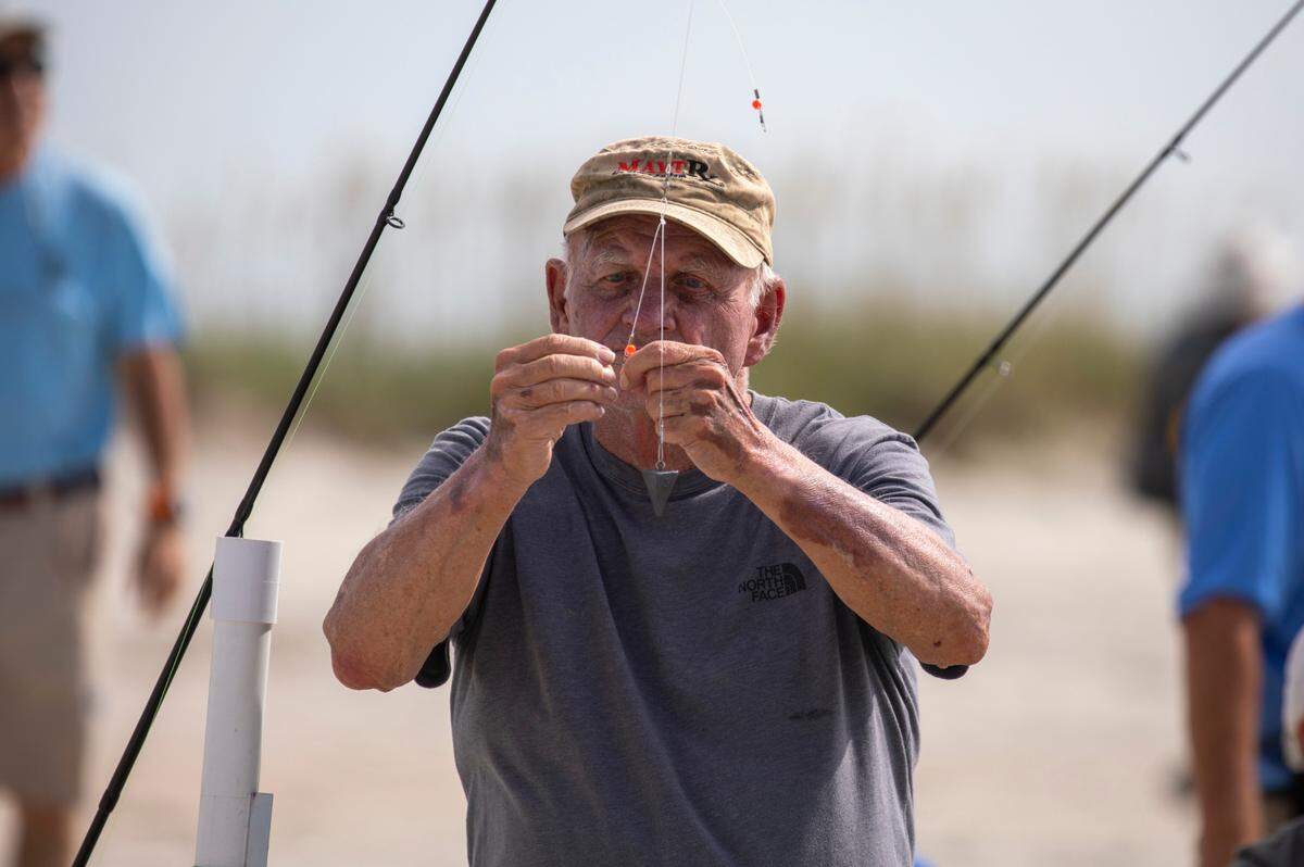 Woody Smith rigs up his baits for a session of surf fishing at Huntington Beach State Park. The South Carolina Department of Natural Resources with the help of volunteers put on a surf fishing clinic at Huntington Beach State Park on Thursday. July 14, 2022.